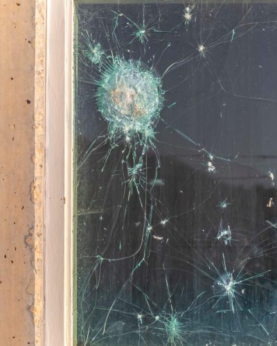 2A721TR Vertical frame Bullet holes in the window glass of a bulletproof bunker